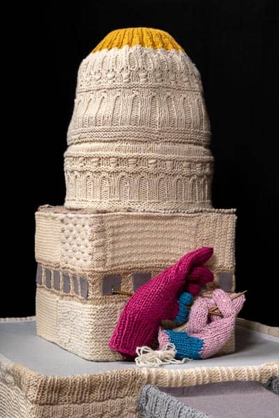 knitted gloves on knitted sculpture of dome tower of state capitol © 2021 Eve Jacobs-Carnahan Knit Democracy Together