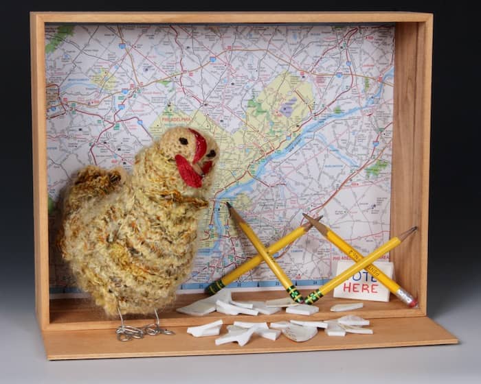 yellow knitted chicken against road map with pencil barrier and voting sign ©2021 Eve Jacobs-Carnahan