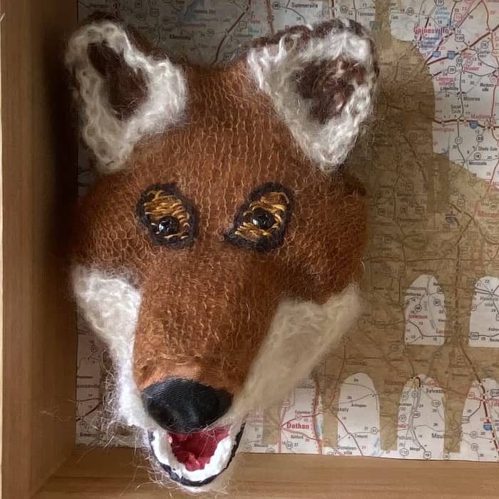 Guarding the House, detail, brown and white knitted fox head sculpture with map, 13 x 21 x 5 in, © 2022 Eve Jacobs-Carnahan