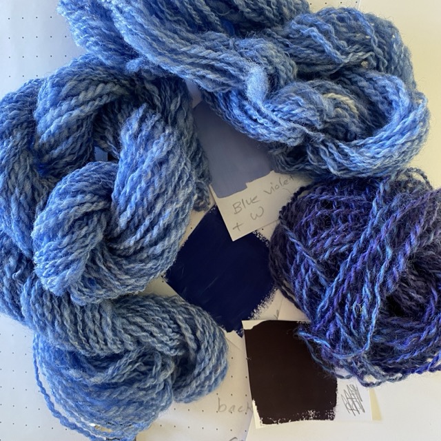 blue violet yarns and paint swatches